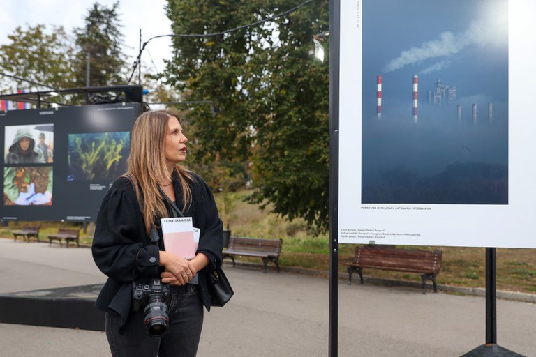 A participant of the “Climate Action Through Poetry and Photography” exhibition at the opening event.